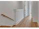 Hallway features hardwood floors and staircase at 150 Rolison Way, Fayetteville, GA 30214