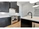 Modern kitchen with stainless steel appliances, an island with seating, and a dishwasher at 150 Rolison Way, Fayetteville, GA 30214