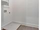 An empty laundry room with tile flooring and hookups for appliances at 150 Rolison Way, Fayetteville, GA 30214