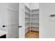 Walk-in pantry with custom shelving for organized storage at 150 Rolison Way, Fayetteville, GA 30214