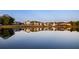 Reflections of homes in the tranquil pond at 150 Rolison Way, Fayetteville, GA 30214