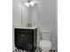 Powder room features a modern vanity and stylish flooring at 150 Rolison Way, Fayetteville, GA 30214