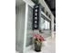 Modern restaurant exterior with vertical sign, beautiful brickwork, and colorful flower arrangement at 150 Rolison Way, Fayetteville, GA 30214