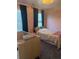 Cozy bedroom with crib, double bed, and window with natural light creating a comfortable and versatile space at 162 Camden Woods Dr, Dallas, GA 30157