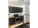 A modern kitchen featuring sleek, black cabinets, light-colored countertops, and stainless steel appliances for a minimalist aesthetic at 162 Camden Woods Dr, Dallas, GA 30157