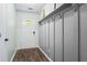 Entryway showcasing wood-look floors, white door, paneled wall and coat hooks at 200 Pine Tree Ln, Mcdonough, GA 30252
