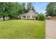 Attractive one-story home with well-maintained lawn, landscaping, and a long driveway at 200 Pine Tree Ln, Mcdonough, GA 30252