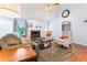 Bright living area with hardwood floors, fireplace, vaulted ceilings, and ample natural light at 200 Pine Tree Ln, Mcdonough, GA 30252