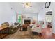 Inviting living room with hardwood floors, fireplace, and a view into the dining area at 200 Pine Tree Ln, Mcdonough, GA 30252