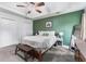 Inviting main bedroom with a tray ceiling, a ceiling fan, and neutral decor at 200 Pine Tree Ln, Mcdonough, GA 30252