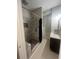 Contemporary bathroom with walk-in shower, gray marble tiling, granite countertop vanity and sleek, modern fixtures at 2500 Trent Dr, Marietta, GA 30066