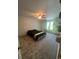 Spacious bedroom featuring plush carpet, a modern ceiling fan, and abundant natural light at 2500 Trent Dr, Marietta, GA 30066
