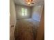 Clean bedroom with carpet, ceiling fan, and natural light streaming through the windows at 2500 Trent Dr, Marietta, GA 30066