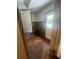 Entryway featuring dark hardwood flooring and neutral wall paneling with multiple doors to other rooms at 2500 Trent Dr, Marietta, GA 30066