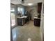 Bright kitchen with stainless steel appliances, a farmhouse sink, tile floors, and access to an outdoor deck at 2500 Trent Dr, Marietta, GA 30066