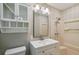 Bathroom featuring white vanity, mirror, updated fixtures, cabinet, and shower at 5510 Stoneybrook Se Ct, Mableton, GA 30126