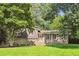 Charming brick and wood home with a well-manicured lawn and mature trees in a peaceful setting at 5510 Stoneybrook Se Ct, Mableton, GA 30126