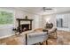 Comfortable living room with a fireplace, tile flooring, and a view into the kitchen and backyard at 5510 Stoneybrook Se Ct, Mableton, GA 30126