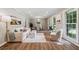 Bright and airy living room with lots of windows, showcasing hardwood floors and fresh decor at 5510 Stoneybrook Se Ct, Mableton, GA 30126
