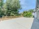 Home featuring a spacious concrete patio and freshly stained fence at 2335 Huntington Dr, Loganville, GA 30052