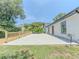 Spacious concrete patio and manicured lawn of this charming home at 2335 Huntington Dr, Loganville, GA 30052