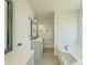 Bathroom featuring a soaking tub and vanity at 2335 Huntington Dr, Loganville, GA 30052