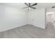 Bedroom with plank flooring, ceiling fan and neutral paint at 2335 Huntington Dr, Loganville, GA 30052