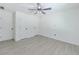 Bedroom with multiple closets and plank flooring, offering ample storage space at 2335 Huntington Dr, Loganville, GA 30052