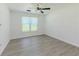 Bedroom with window and plank flooring, offering a bright and inviting atmosphere at 2335 Huntington Dr, Loganville, GA 30052