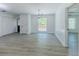Dining area features wainscoting, a modern light fixture, and gray wood-look flooring, creating an inviting space at 2335 Huntington Dr, Loganville, GA 30052