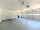 Spacious garage featuring two car doors and access door to the exterior at 2335 Huntington Dr, Loganville, GA 30052