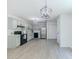 Bright kitchen with stainless steel appliances, subway tile backsplash, and light grey cabinets at 2335 Huntington Dr, Loganville, GA 30052