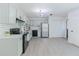 Spacious kitchen with stainless steel appliances, white cabinets, and subway tile backsplash, perfect for cooking at 2335 Huntington Dr, Loganville, GA 30052