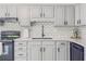 Kitchen area featuring quartz countertops, stainless steel appliances, and subway tile backsplash at 2335 Huntington Dr, Loganville, GA 30052