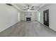 Bright living room showcasing wood flooring, a gray fireplace, and large windows for natural light at 2335 Huntington Dr, Loganville, GA 30052