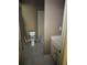 Small bathroom features a toilet and vanity ready to be renovated at 4504 Allen Hollow, Suwanee, GA 30024