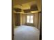 Spacious bedroom featuring a tray ceiling, neutral walls, and a large window offering ample natural light at 4504 Allen Hollow, Suwanee, GA 30024