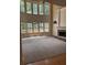 Bright living room boasts two-story windows, a fireplace, and built-in shelving, perfect for entertaining at 4504 Allen Hollow, Suwanee, GA 30024