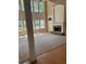 Large living room with soaring ceilings, stone fireplace, and expansive windows for natural light at 4504 Allen Hollow, Suwanee, GA 30024