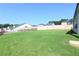 Large grassy backyard enclosed by a wooden fence, perfect for outdoor activities at 1057 Towne Mill Xing, Canton, GA 30114
