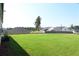 Large backyard with green grass at 1057 Towne Mill Xing, Canton, GA 30114