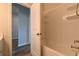 Clean bathroom featuring a shower-tub combination with tiled surround and vanity at 1057 Towne Mill Xing, Canton, GA 30114