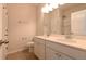 Bathroom with dual sinks, large mirror, and combination shower and tub at 1057 Towne Mill Xing, Canton, GA 30114