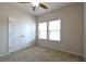 Cozy bedroom with plush carpeting, a ceiling fan, and a spacious closet at 1057 Towne Mill Xing, Canton, GA 30114