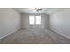 Spacious bedroom with neutral walls, carpet flooring, ceiling fan, and lots of natural light at 1057 Towne Mill Xing, Canton, GA 30114