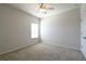 Bedroom featuring neutral carpeting, a ceiling fan, closet, and large windows at 1057 Towne Mill Xing, Canton, GA 30114