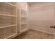 Bright walk-in closet with built-in shelving at 1057 Towne Mill Xing, Canton, GA 30114