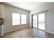 Bright dining area with wood floors, natural light, and a sliding door to the backyard at 1057 Towne Mill Xing, Canton, GA 30114