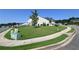 View of the house from the street, showing a large, grassy yard and the home's architecture at 1057 Towne Mill Xing, Canton, GA 30114