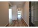Inviting hallway with wood floors leading to a bright and airy living space at 1057 Towne Mill Xing, Canton, GA 30114